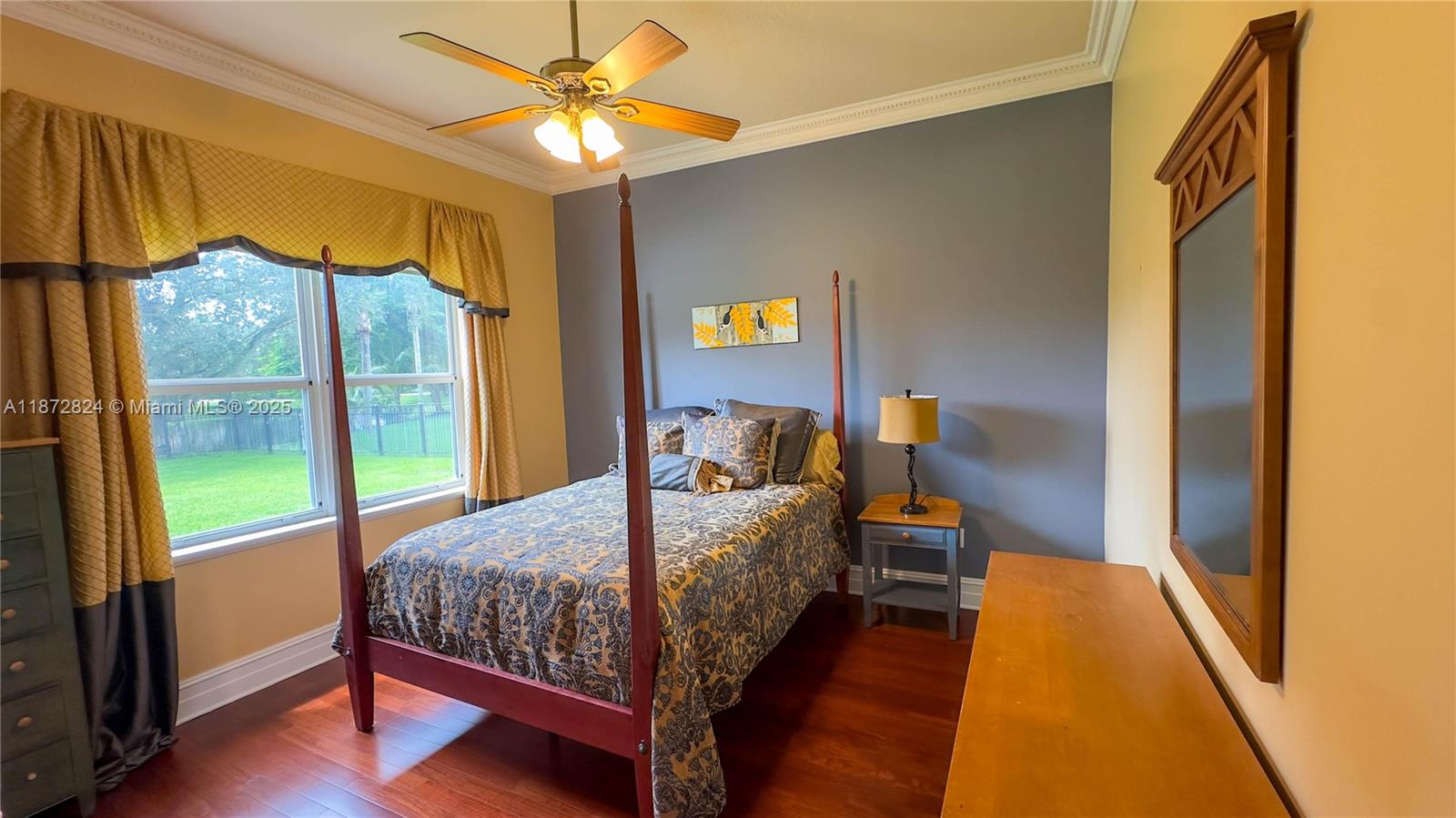 13040 Southwest 30th Court Davie, FL 33330 - Photo 32 of 42 a bedroom with a bed and a mirror on the dresser