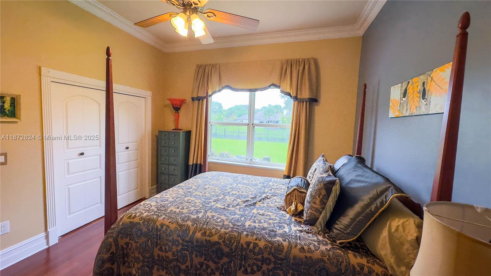 13040 Southwest 30th Court Davie, FL 33330 - Photo 33 of 42 a bedroom with a bed and a chandelier