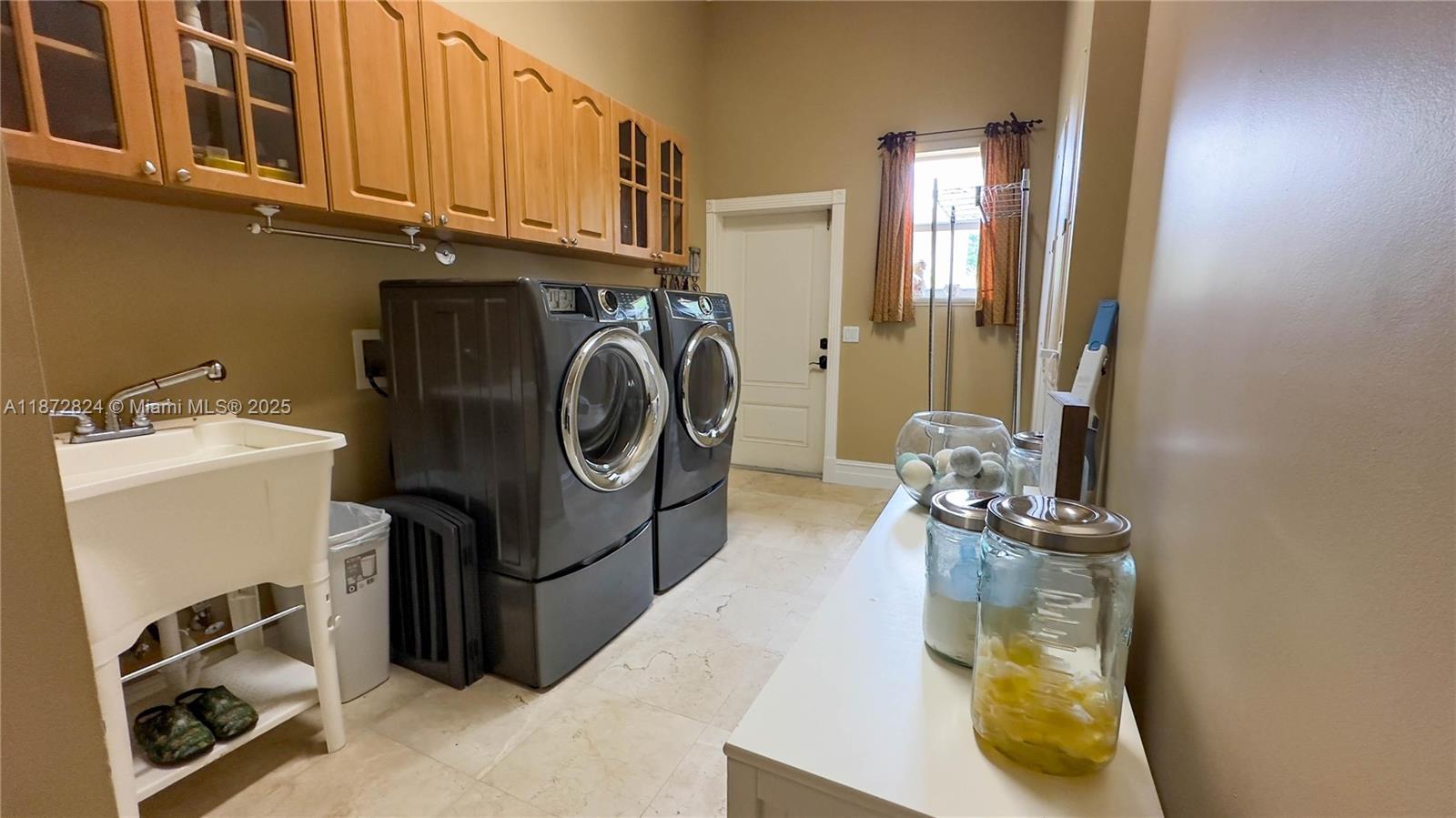 13040 Southwest 30th Court Davie, FL 33330 - Photo 34 of 42 a utility room with dryer and washer