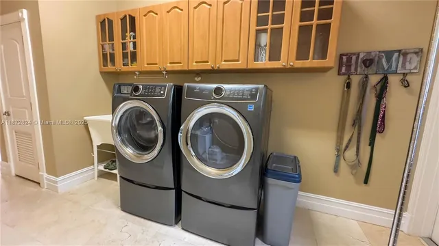 a utility room with dryer and washer