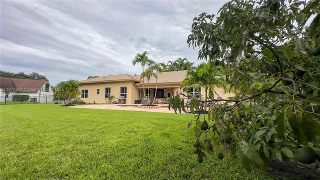 a front view of house with yard and seating area