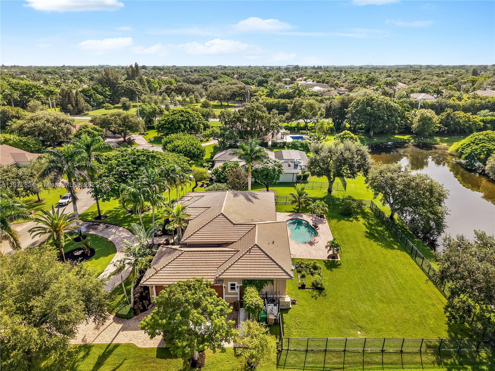 13040 Southwest 30th Court Davie, FL 33330 - Photo 41 of 42 an aerial view of residential houses with outdoor space