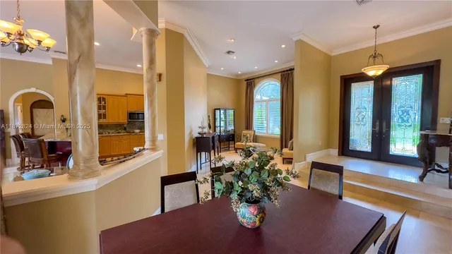 a lobby with furniture and a potted plant