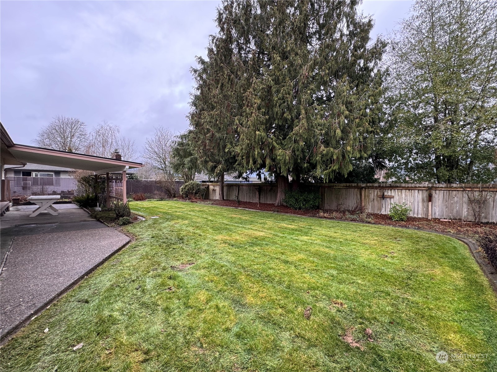 4610 Windemere Street Longview, WA 98632 - Photo 15 of 16 a view of a backyard with a garden and entertaining space