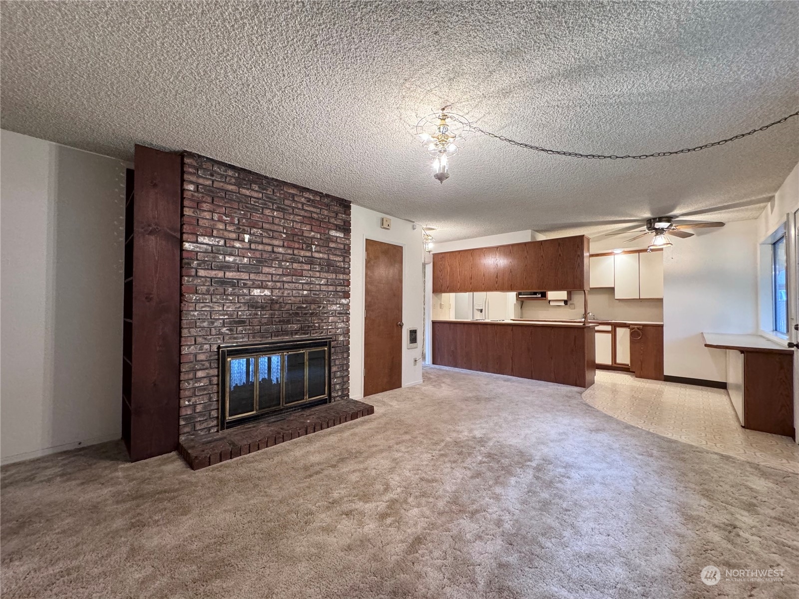 4610 Windemere Street Longview, WA 98632 - Photo 3 of 16 a view of a livingroom with a fireplace