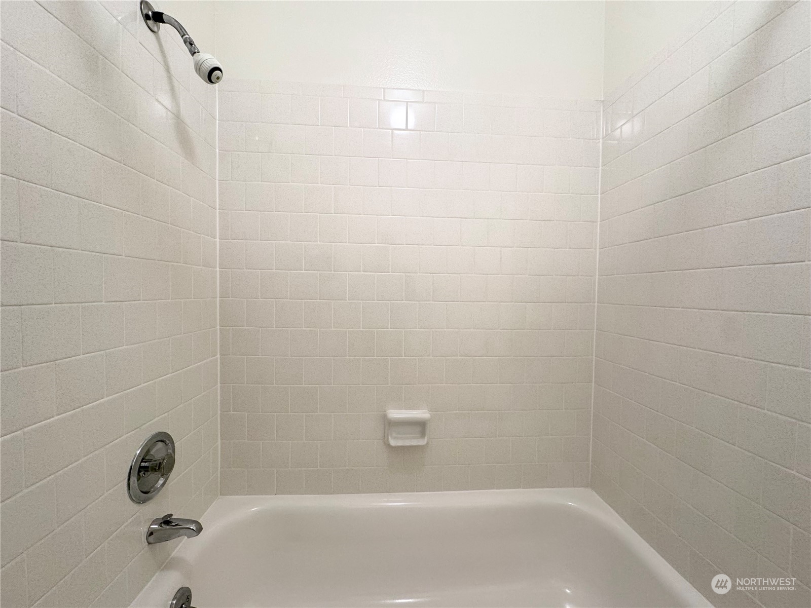 4610 Windemere Street Longview, WA 98632 - Photo 9 of 16 a bathroom with a shower and a bathtub