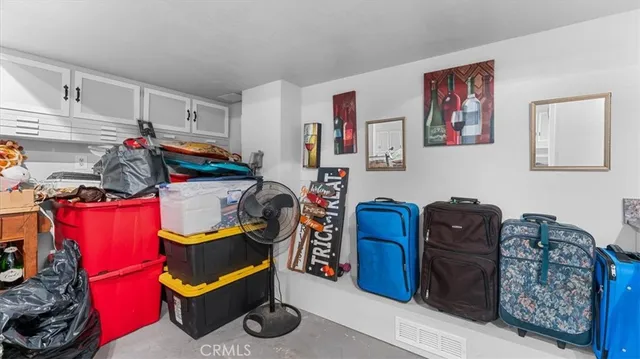 a bed room with a bed and a chair