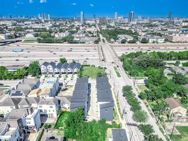 an aerial view of residential houses with outdoor space