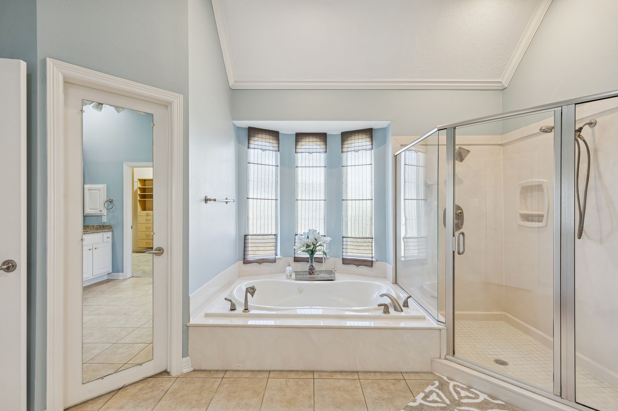 2202 Britton Ridge Drive Katy, TX 77494 - Photo 15 of 41 This amazing soaking tub serves as a striking focal point, complemented by a spacious walk-in shower with a frameless glass enclosure.