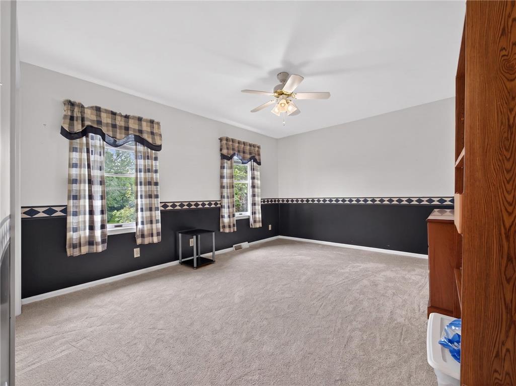 853 Lahr Road Nazareth, PA 18064 - Photo 16 of 29 Well-lit room with ample natural light from multiple windows and soft carpeting.