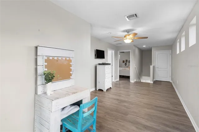 a view of an entryway with wooden floor
