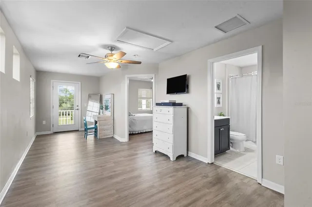 a view of a livingroom with furniture and a flat screen tv