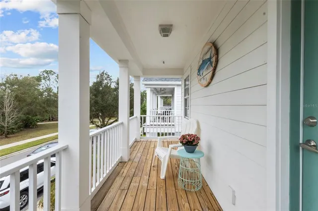 a view of balcony with wooden floor