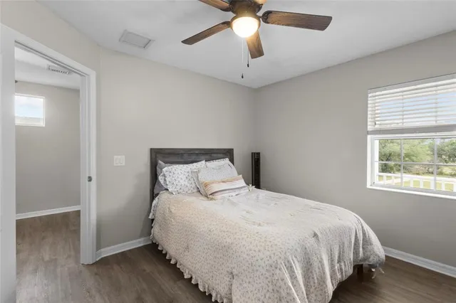 a bedroom with bed and window