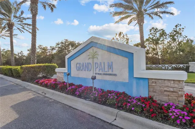 a sign that is in front of flowers