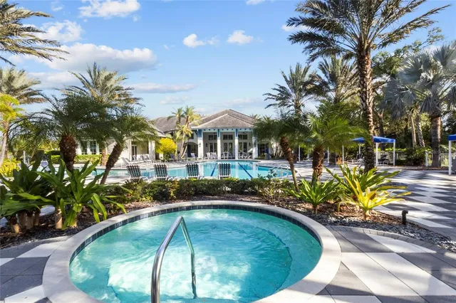 a view of a swimming pool with a patio