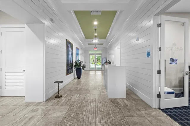 a view of a hallway with a living room