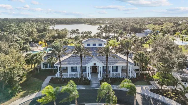 an aerial view of a house with a big yard