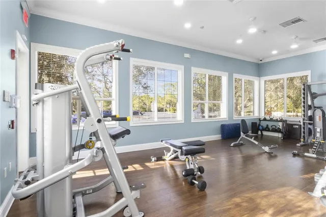 a view of a livingroom with workspace and a window