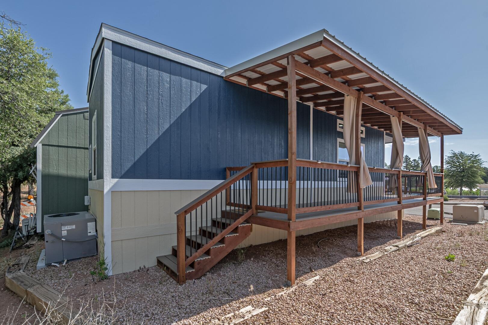 16 North Star Vale Road, Unit 122B Star Valley, AZ 85541 - Photo 21 of 21 a view of a house with a small deck and wooden floor