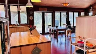 a dining room with furniture and window