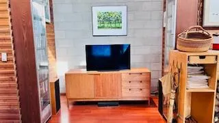 a living room with a flat screen tv