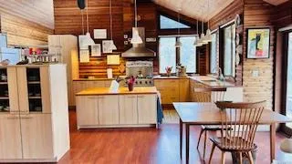 a kitchen with stainless steel appliances granite countertop a sink and cabinets