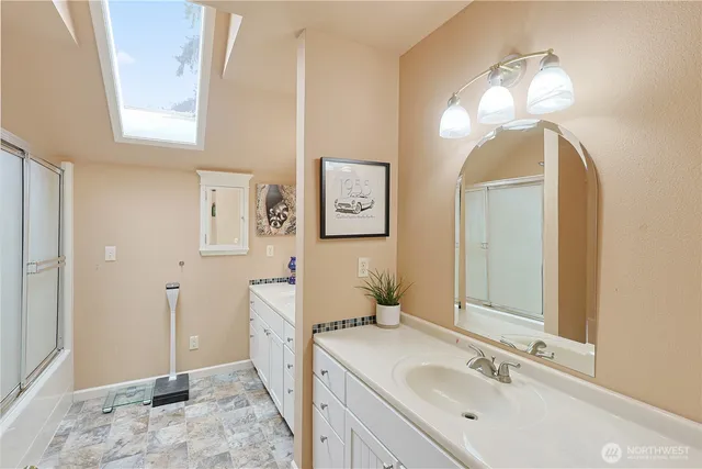a bathroom with a sink and a mirror
