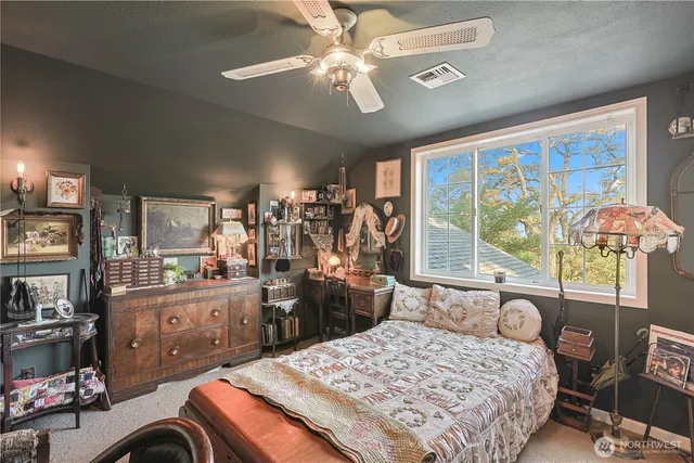 a bed room with a bed and a chandelier