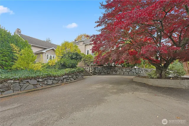 a view of a street with a building in the background