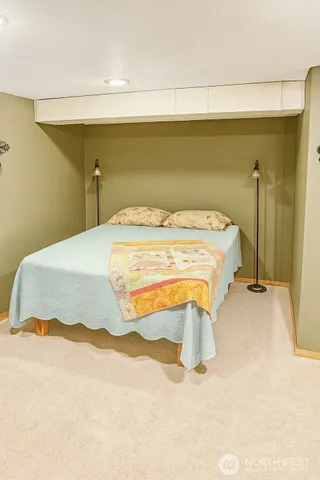 a bedroom with a bed and a table in it