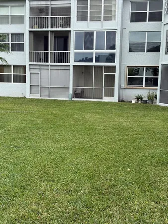 a view of a house with a garden