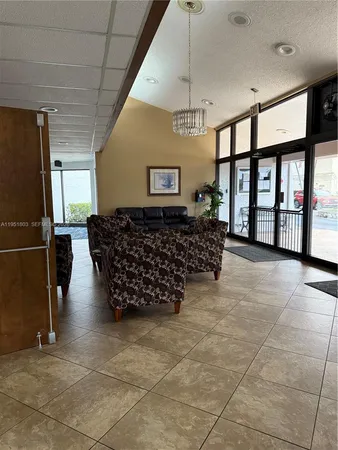 a living room with furniture a dining table and chairs with wooden floor