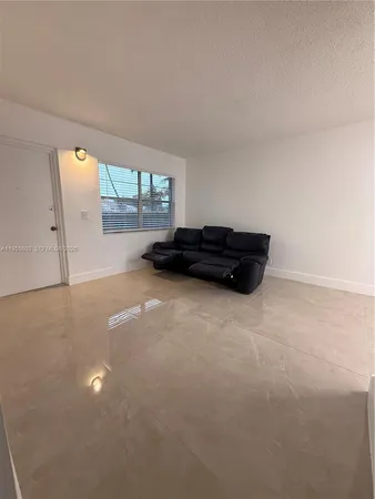 a view of a big room with windows and air conditioner