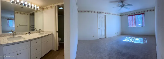 a bathroom with a double vanity sink and mirror