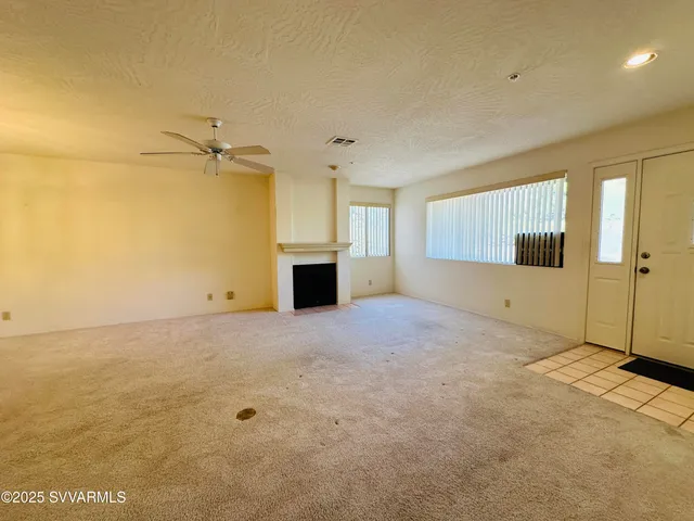 a view of empty room with windows