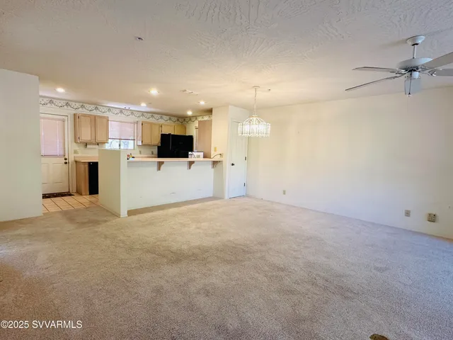 a view of a livingroom and a kitchen