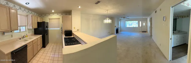 a view of a bathroom with sink and mirror