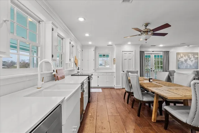 a large kitchen with a table and chairs