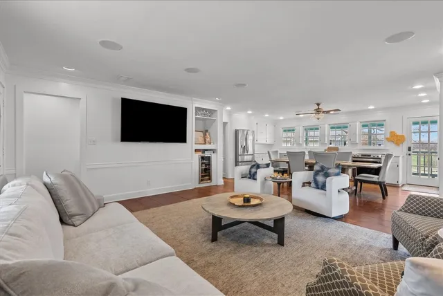 a living room with lots of furniture and a flat screen tv