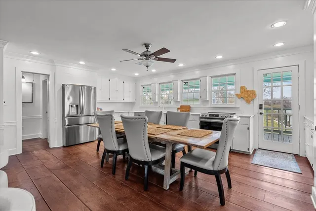 a view of a dining room with furniture and wooden floor