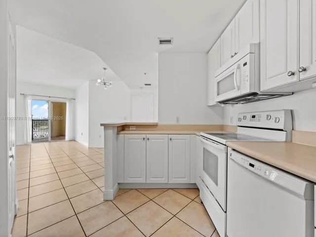 a kitchen with white cabinets