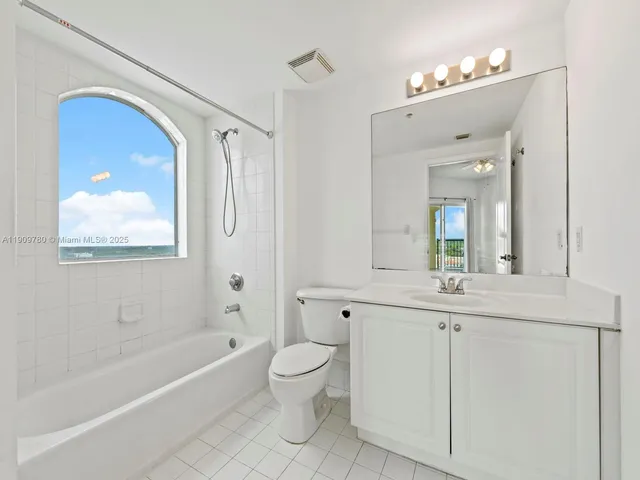 a bathroom with a toilet a sink and a bathtub