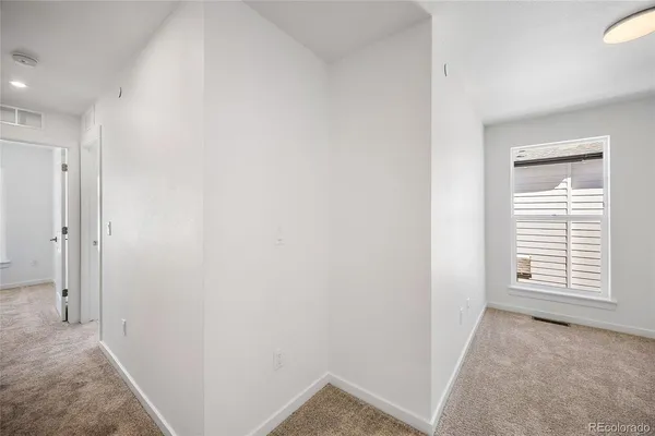 a view of an empty room with a window