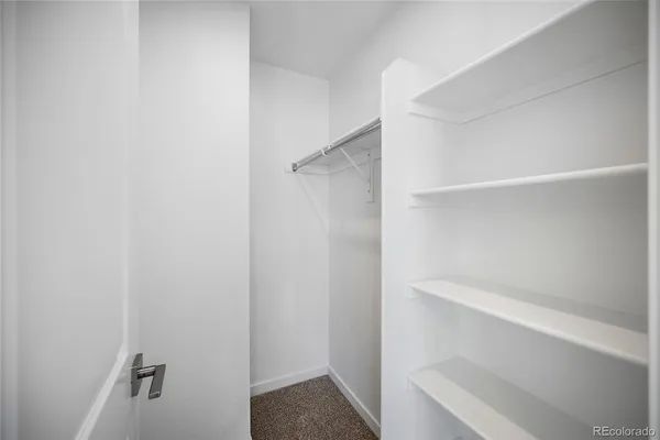 a view of an empty walk in closet