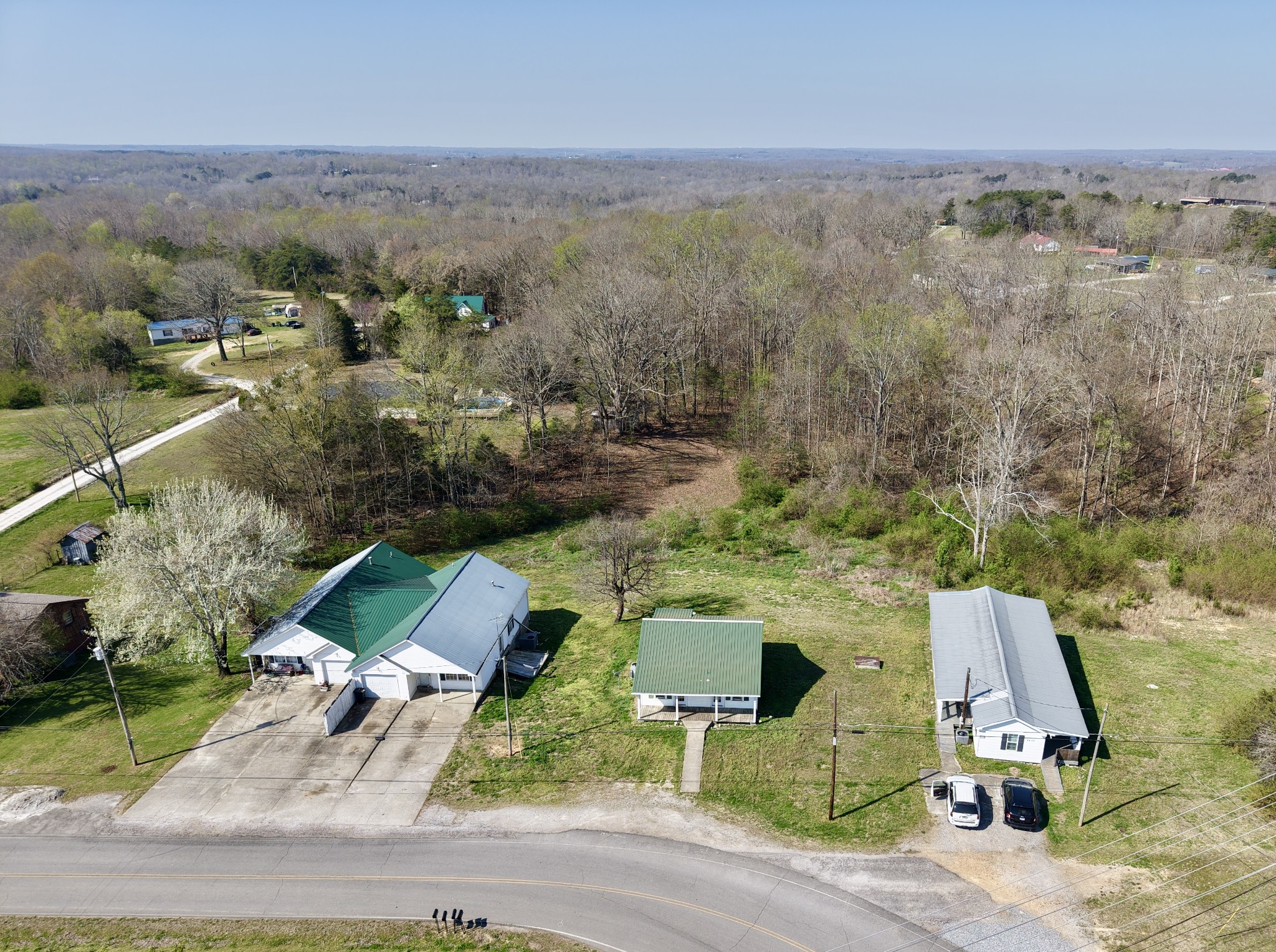 1431 Old Charlotte Road White Bluff, TN 37187 - Photo 2 of 8 an aerial view of a house with a garden