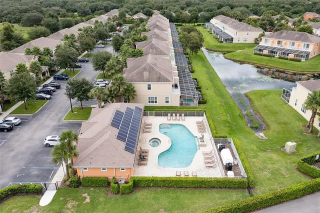 an aerial view of residential houses with outdoor space