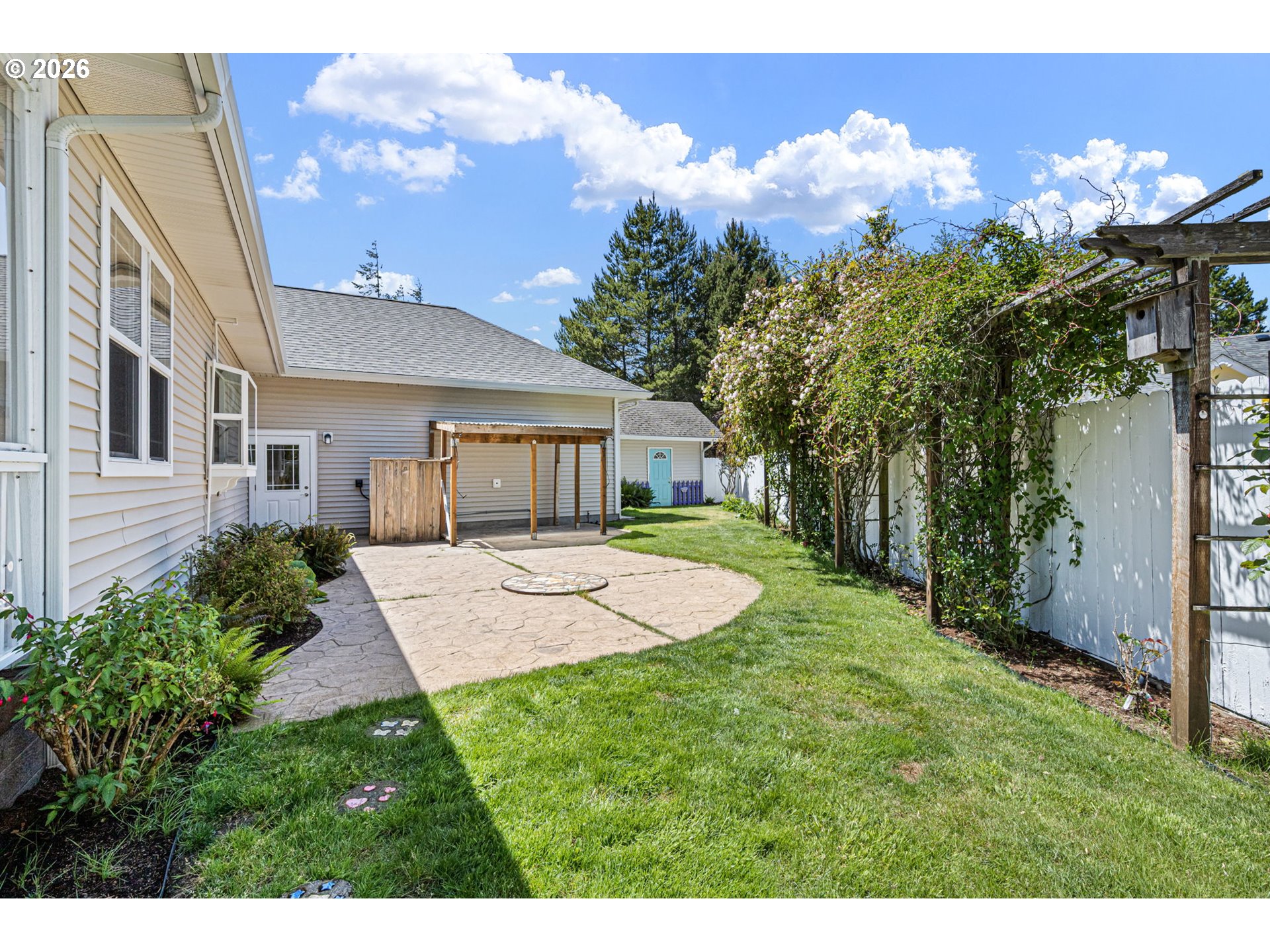 2218 Willow Loop Florence, OR 97439 - Photo 39 of 47 a view of a house with a backyard