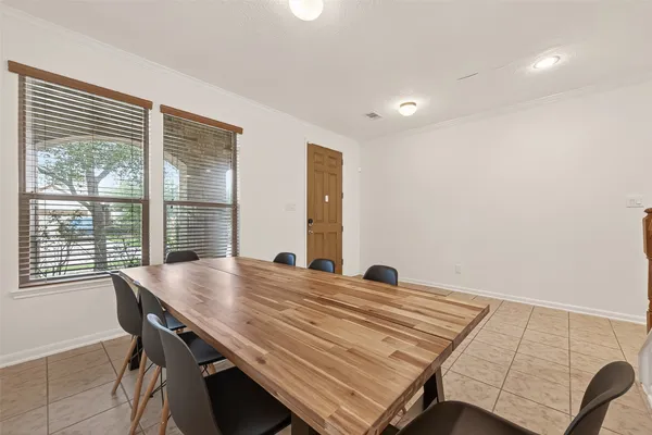 a view of a dining room with furniture window and outside view
