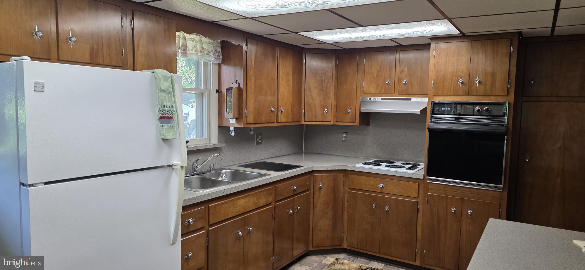 4819 Five Point Road New Tripoli, PA 18066 - Photo 36 of 52 a kitchen with a refrigerator and a sink